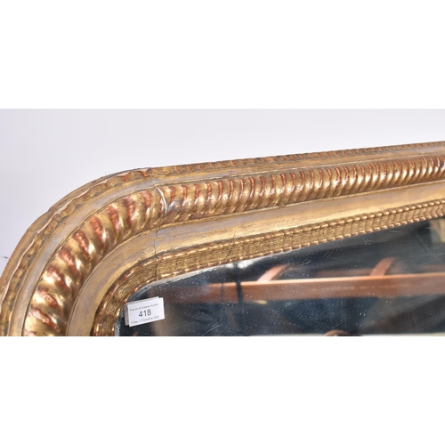 418 - A large 19th century Victorian giltwood mirror. The mirror of rectangular form with rope twist desig... 