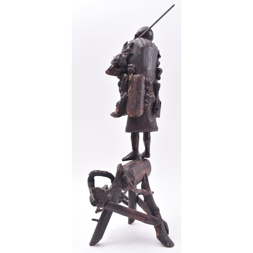 421 - A 19th century Japanese carved root wood figure of a fisherman. The carving stood upright with rod o... 