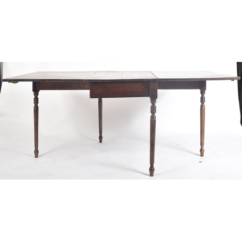 425 - A large Victorian 19th century oak extending three piece dining table. The table having a central dr... 