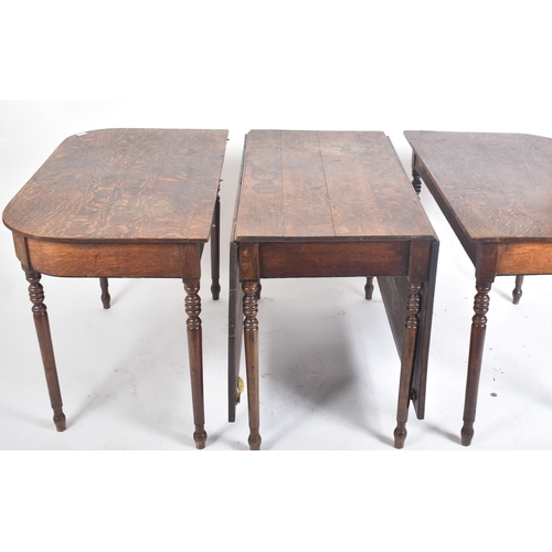 425 - A large Victorian 19th century oak extending three piece dining table. The table having a central dr... 