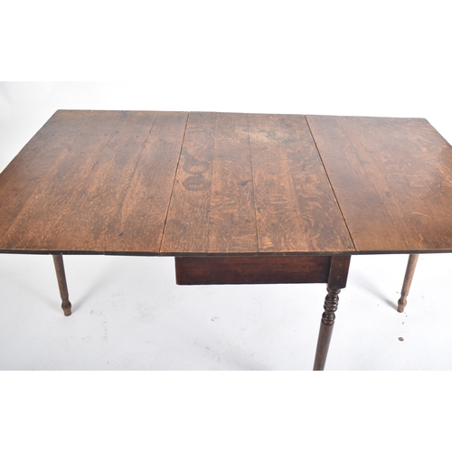 425 - A large Victorian 19th century oak extending three piece dining table. The table having a central dr... 