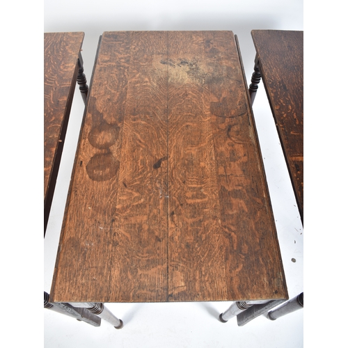 425 - A large Victorian 19th century oak extending three piece dining table. The table having a central dr... 