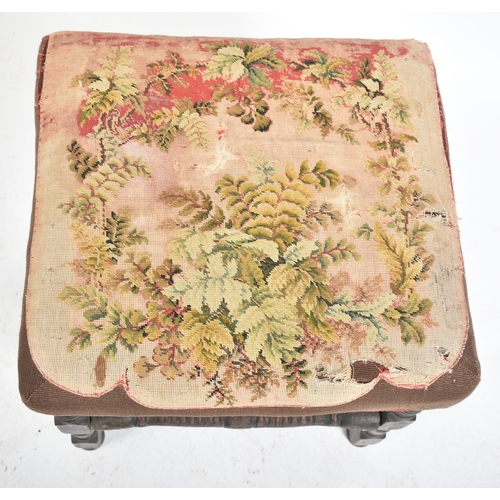 427 - An 18th century English oak and tapestry upholstered stool. The stool with tapestry overstuffed seat... 