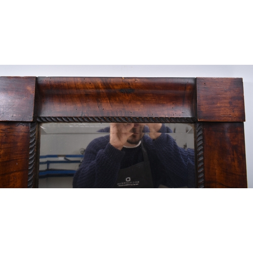 430 - A 19th century fruitwood Biedermeier continental cushion framed mirror. The cushion frame with centr... 