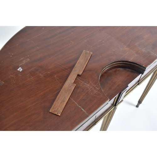 431 - A 19th century Victorian mahogany and brass bound games / card table or roulette table. The table of... 