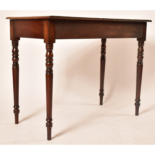 432 - A late Victorian 19th century mahogany writing table desk. The desk being raised on turned legs with... 