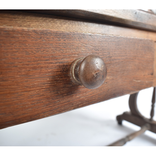 433 - A 19th century French solid oak writing table desk. The desk being raised on lyre shaped supports wi... 