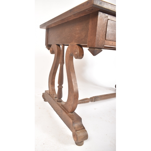 433 - A 19th century French solid oak writing table desk. The desk being raised on lyre shaped supports wi... 