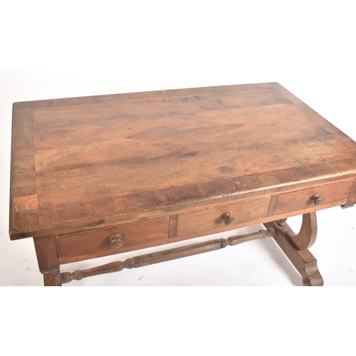 433 - A 19th century French solid oak writing table desk. The desk being raised on lyre shaped supports wi... 