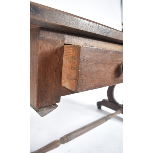 433 - A 19th century French solid oak writing table desk. The desk being raised on lyre shaped supports wi... 