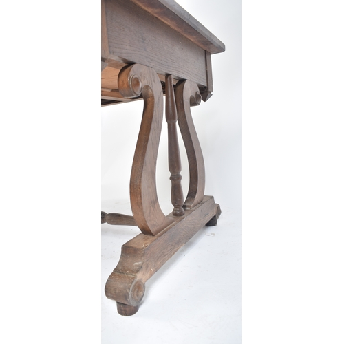 433 - A 19th century French solid oak writing table desk. The desk being raised on lyre shaped supports wi... 