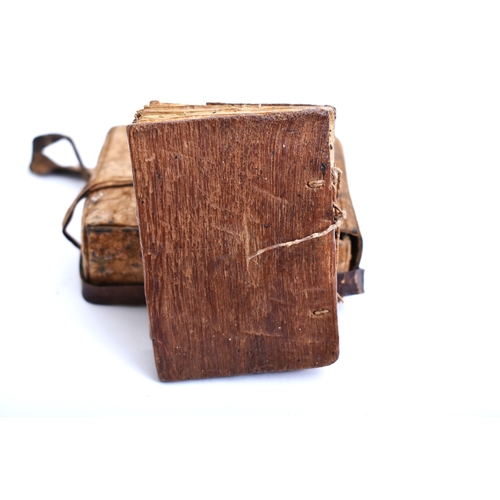 434 - An early 20th century Ethiopian Coptic manuscript prayer book bound in hardwood boards with vellum l... 