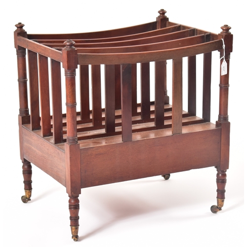 437 - A George III 19th century mahogany magazine rack. The rack having four turned finials atop over a fo... 