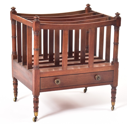 437 - A George III 19th century mahogany magazine rack. The rack having four turned finials atop over a fo... 