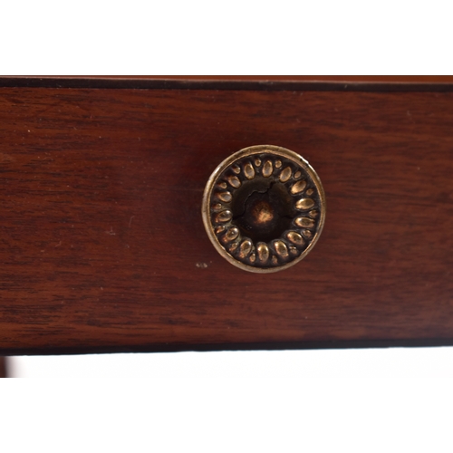 437 - A George III 19th century mahogany magazine rack. The rack having four turned finials atop over a fo... 