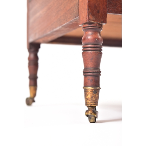 437 - A George III 19th century mahogany magazine rack. The rack having four turned finials atop over a fo... 