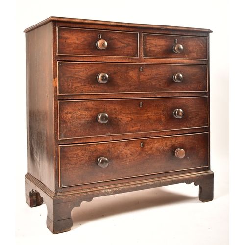 438 - A 19th century George III North Country oak chest of drawers. Raised on bracket feet with short and ... 