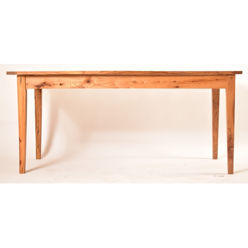 440 - A late 20th century elm wood refectory farmhouse dining table. The table having a rectangular square... 