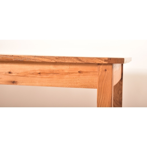 440 - A late 20th century elm wood refectory farmhouse dining table. The table having a rectangular square... 