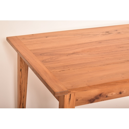 440 - A late 20th century elm wood refectory farmhouse dining table. The table having a rectangular square... 