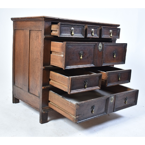 443 - A 17th century commonwealth oak block fronted chest of drawers. Raised on stile legs with short and ... 