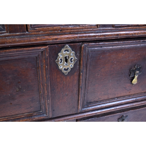 443 - A 17th century commonwealth oak block fronted chest of drawers. Raised on stile legs with short and ... 