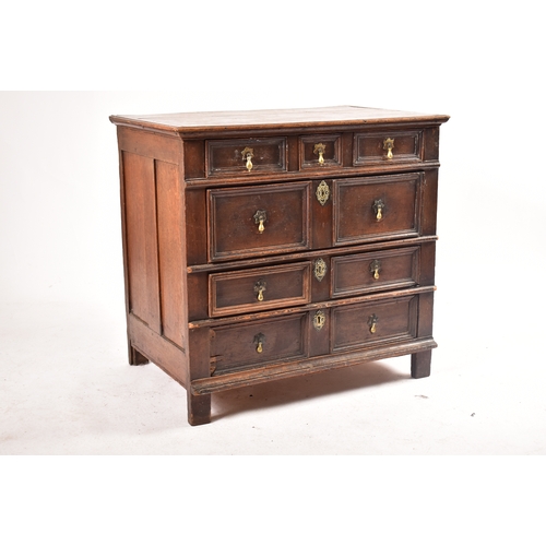 443 - A 17th century commonwealth oak block fronted chest of drawers. Raised on stile legs with short and ... 