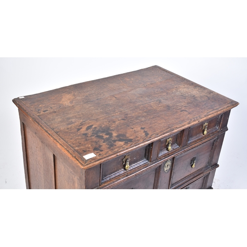 443 - A 17th century commonwealth oak block fronted chest of drawers. Raised on stile legs with short and ... 