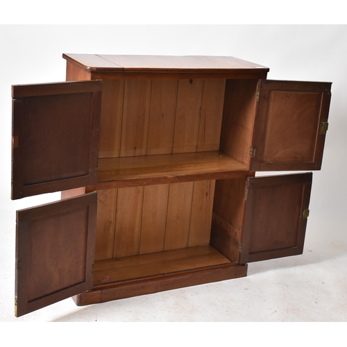 445 - An early 20th century 1900s mahogany twin door school - estate cupboard. Raised on a plinth base wit... 