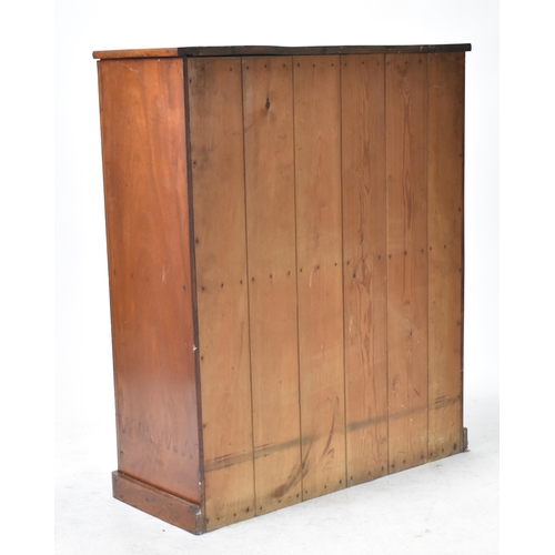 445 - An early 20th century 1900s mahogany twin door school - estate cupboard. Raised on a plinth base wit... 