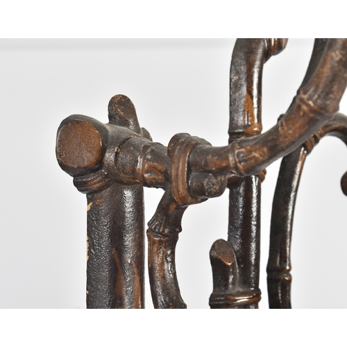 447 - A vintage Coalbrookdale manner faux bamboo cast iron hall stand. The stand having an elaborate back ... 