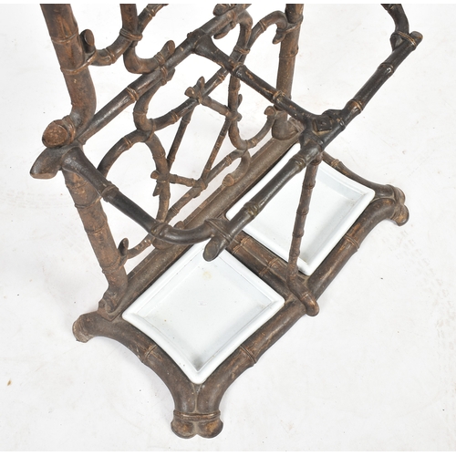 447 - A vintage Coalbrookdale manner faux bamboo cast iron hall stand. The stand having an elaborate back ... 