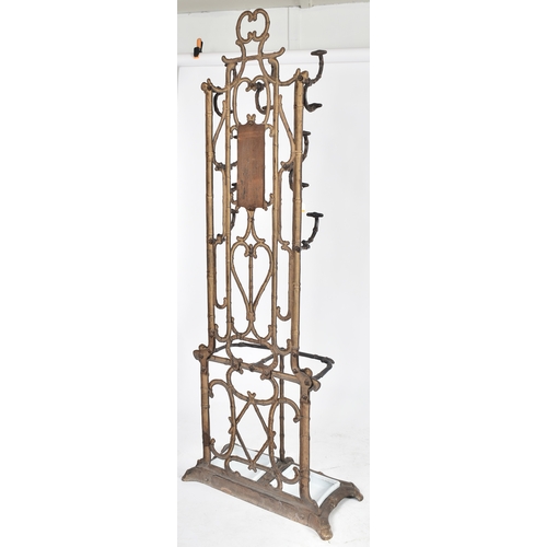 447 - A vintage Coalbrookdale manner faux bamboo cast iron hall stand. The stand having an elaborate back ... 