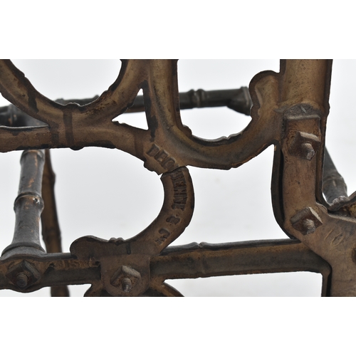 447 - A vintage Coalbrookdale manner faux bamboo cast iron hall stand. The stand having an elaborate back ... 