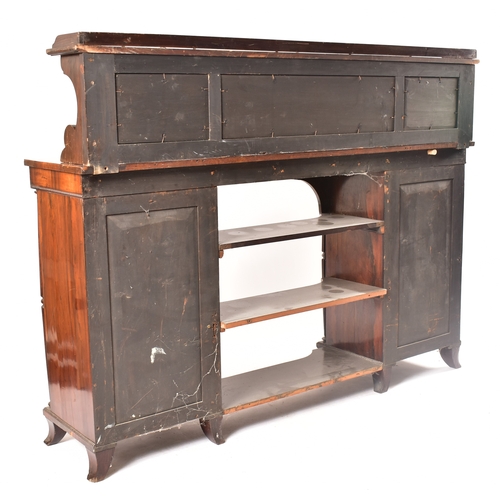 450 - A 19th century rosewood credenza having an open window bookcase with arched top flanked by end glass... 