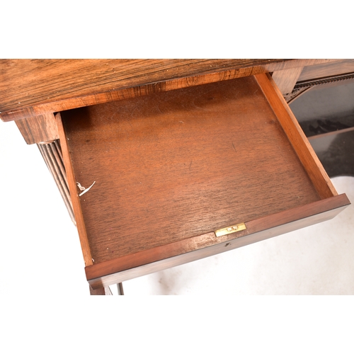 450 - A 19th century rosewood credenza having an open window bookcase with arched top flanked by end glass... 