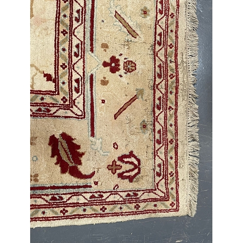 485 - A large early 20th century Afghan Islamic Ziegler floor carpet rug. The rug in a cream & red colourw... 