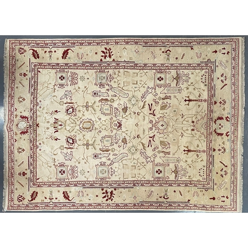 485 - A large early 20th century Afghan Islamic Ziegler floor carpet rug. The rug in a cream & red colourw... 