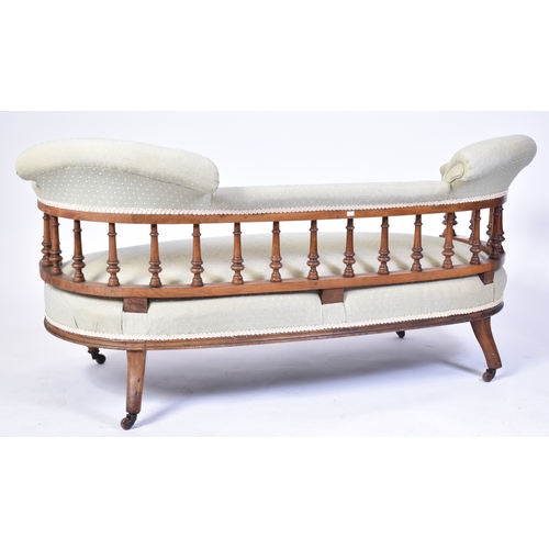 347 - A 19th century Victorian mahogany inlaid salon sofa settee. Raised on reeded inlaid turned and taper... 