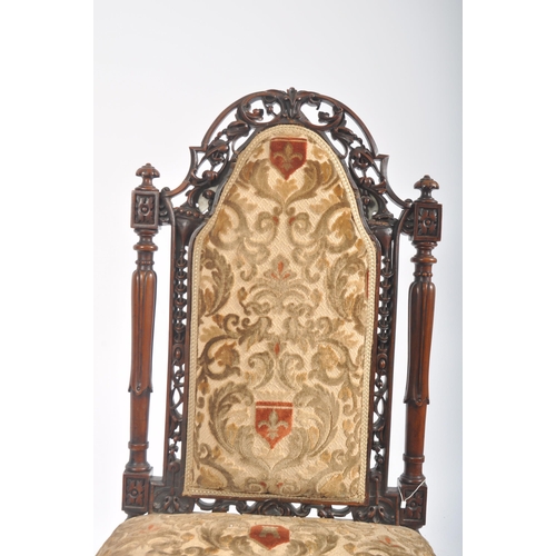 429 - A Victorian 19th century walnut nursing - ladies chair. The chair having a pierced foliate top & bac... 