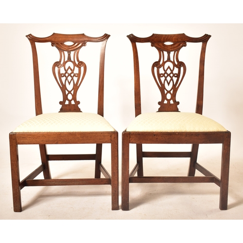 196 - A 19th century George III mahogany extending D-end table with and four chairs. The table having two ... 