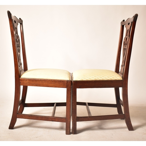 196 - A 19th century George III mahogany extending D-end table with and four chairs. The table having two ... 