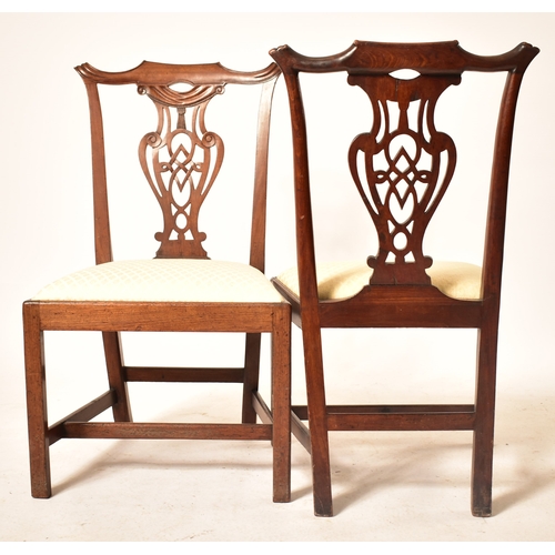 196 - A 19th century George III mahogany extending D-end table with and four chairs. The table having two ... 