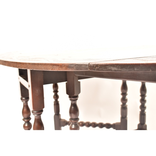 452 - A 19th century carved oak gateleg table. The table having central carved decoration with further det... 