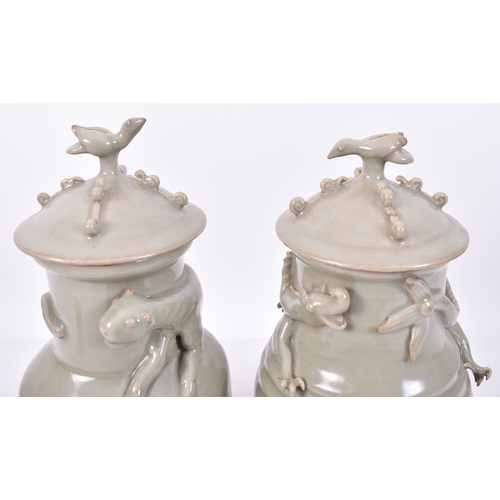 345 - A pair of Chinese Oriental Song Dynasty manner ceramic celadon funerary lidded urns / vases. Each va... 