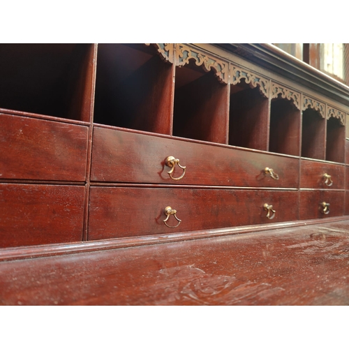 57 - A 19th century George III mahogany secretaire / estate bureau bookcase. Raised on a plinth base with... 