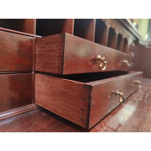 57 - A 19th century George III mahogany secretaire / estate bureau bookcase. Raised on a plinth base with... 