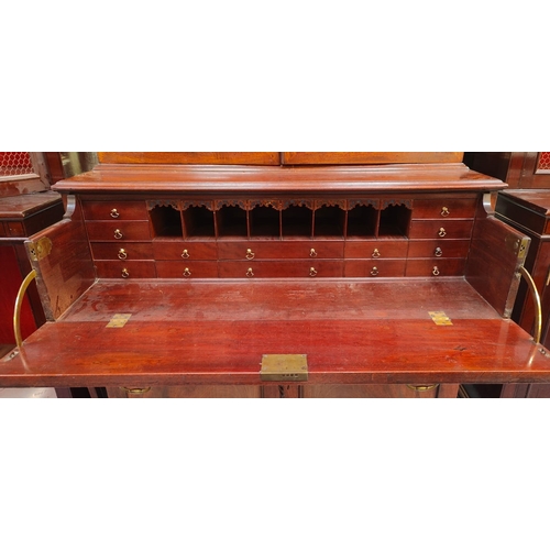 57 - A 19th century George III mahogany secretaire / estate bureau bookcase. Raised on a plinth base with... 