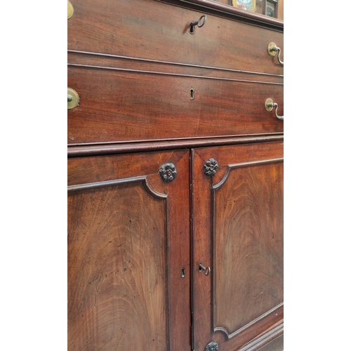 57 - A 19th century George III mahogany secretaire / estate bureau bookcase. Raised on a plinth base with... 