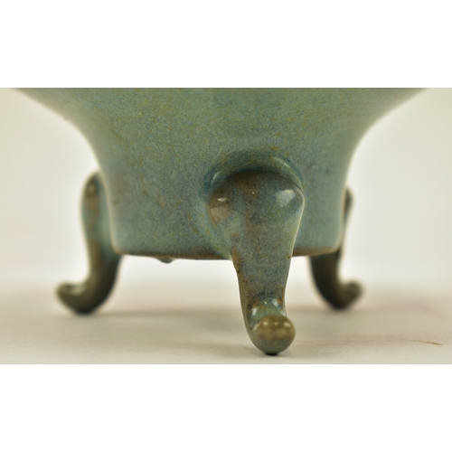 106 - A Chinese Oriental Qing Dynasty Ru Ware manner celadon ceramic tripod censer. The censer having a fl... 